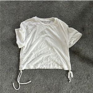 White tee with ties on the size